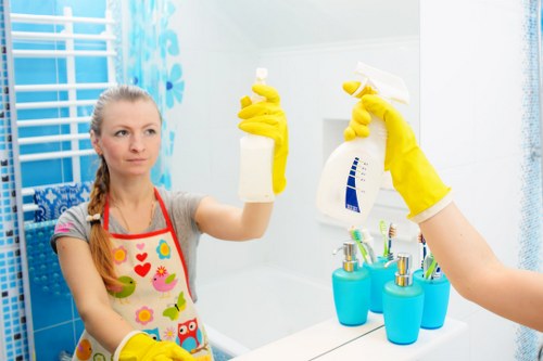 Cleaner preparing a kitchen and worktops in a Lambeth property