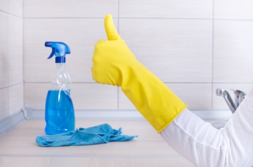 Cleaner maintaining a shared office kitchen in a Lambeth commercial property