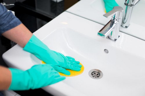 Cleaner wiping kitchen surfaces during a one off clean in Lambeth