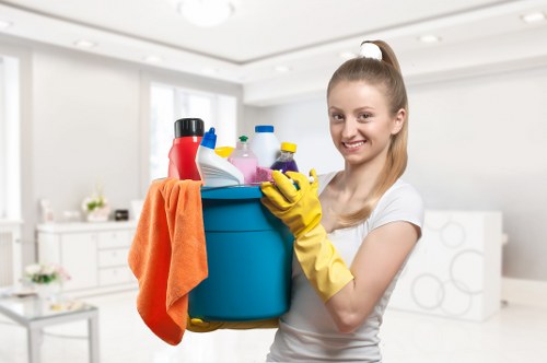Cleaner wiping kitchen surfaces during a Lambeth regular cleaning visit